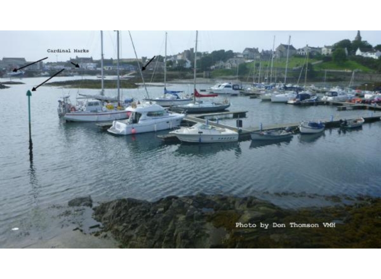Marina showing the Cardinal marks around the Central Reef