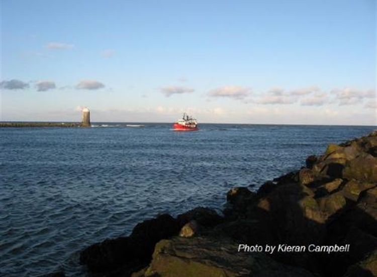Drogheda channel entrance.Trawler inbound past the Aleria Beacon