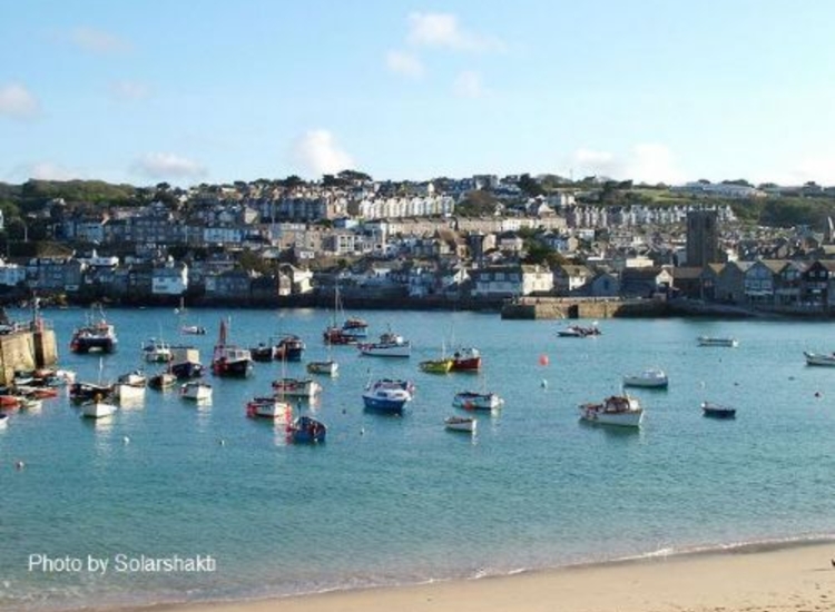 St Ives at High Water. Note empty alongside drying berth on Harbour Wall top right