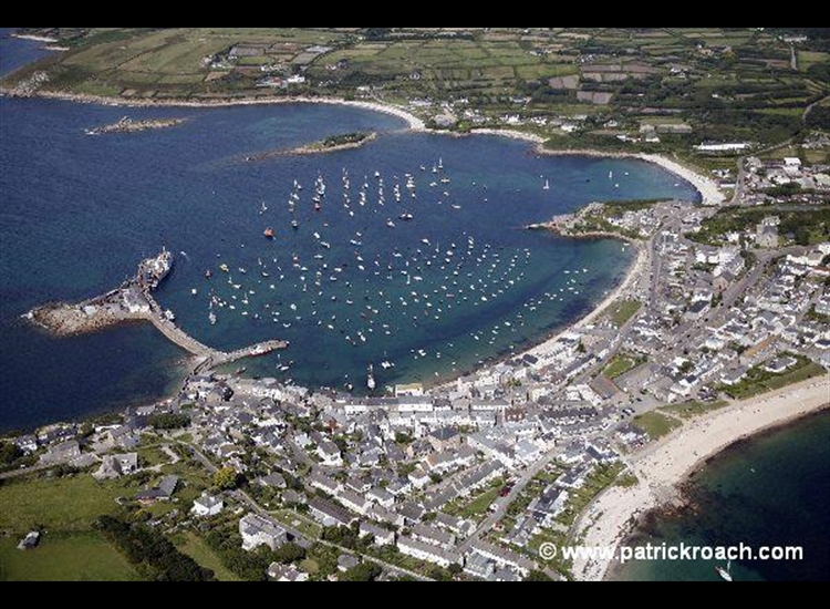 St Mary's Harbour  with Porth Cressa Beach bottom right